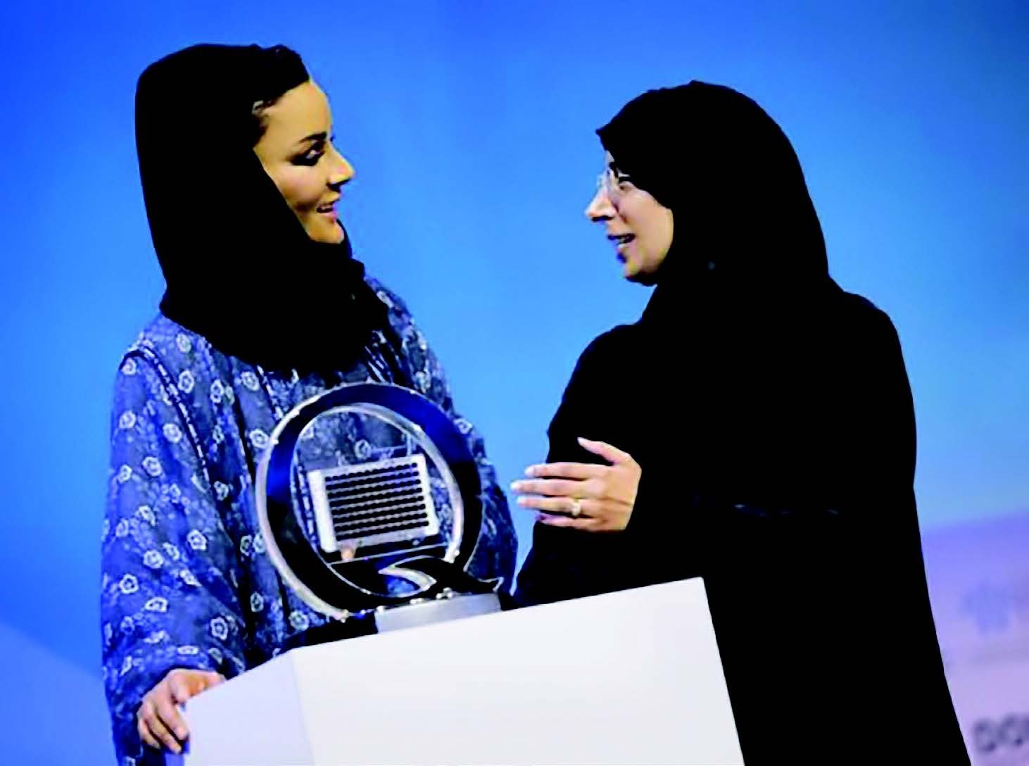 Dr. Hanan Mohamed al-Kuwari (right), Qatar's minister of public health, presents a model of the Q-chip to Her Highness Sheikha Moza bint Nasser, chair of the Qatar Foundation, at the World Innovation Summit for Health in November 2018.