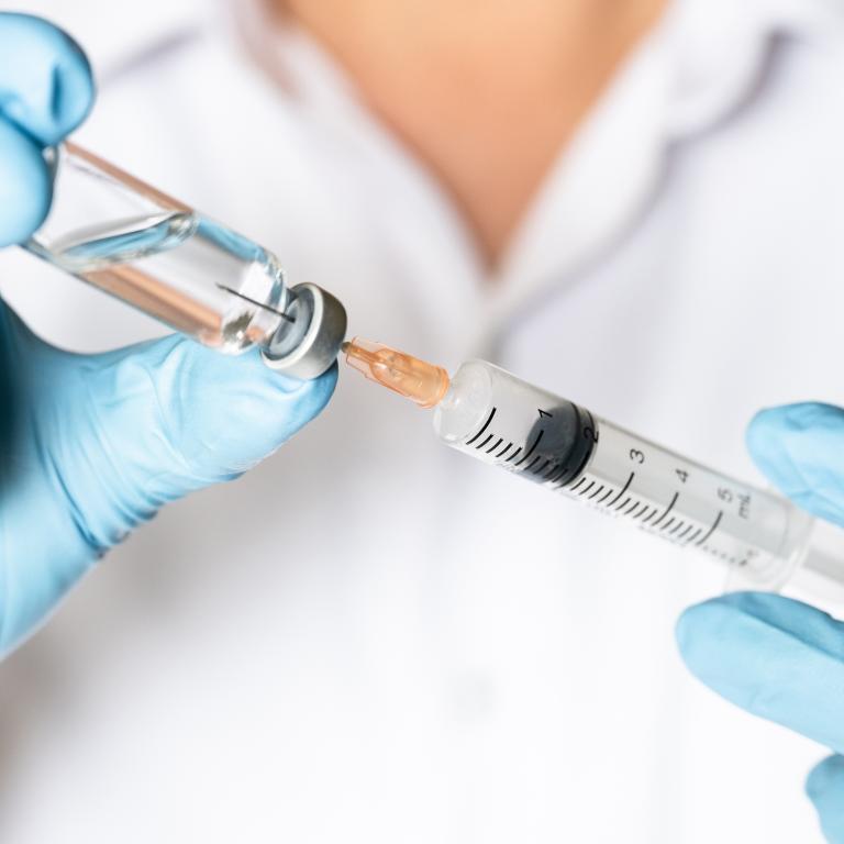 Needle in vaccine vial