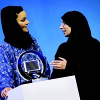 Dr. Hanan Mohamed al-Kuwari (right), Qatar's minister of public health, presents a model of the Q-chip to Her Highness Sheikha Moza bint Nasser, chairperson of the Qatar Foundation, at the World Innovation Summit for Health in November 2018.